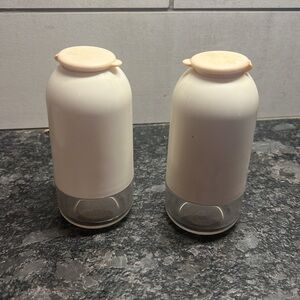 Set of salt and pepper shakers by Tupperware. Pink and white. Possibly NEW